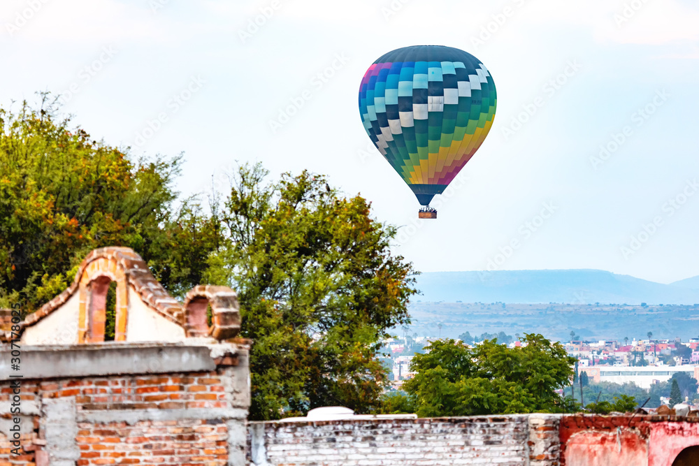 hot air balloon in the sky over san miguel de allende